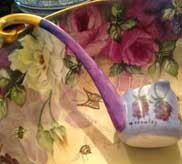 Decorative floral patterned fabric with antique teacup and yellow scissors
