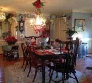 Formal dining room with mahogany table set for Christmas dinner